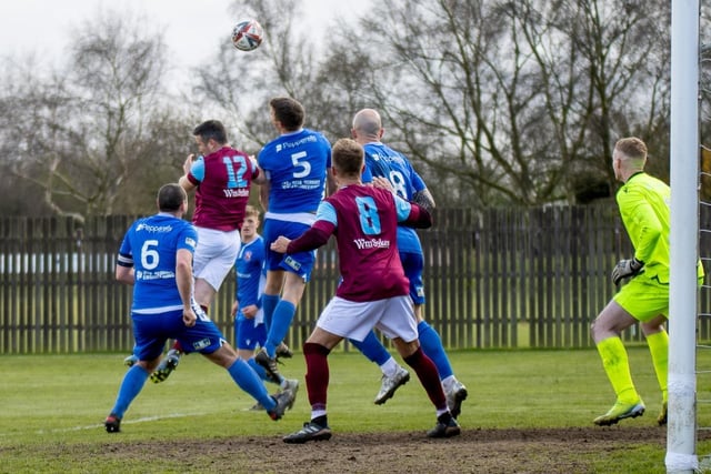 Emley number 12 James Knowles challenges for a high ball into the box. Picture: Mark Parsons