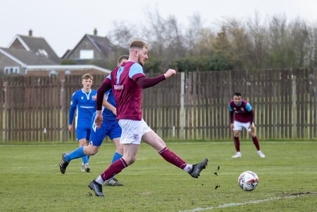 George Doyle calmly shoots to score Emley's third goal against Winterton Rangers. Picture: Mark Parsons