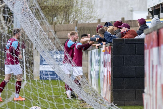 Players and fans join in celebrations as Emley AFC go ahead against Winterton Rangers. Picture: Mark Parsons