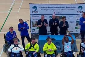 The England Powerchair Football team, including Dan Rigby, from Wakefield, celebrate winning the Home Nations Cup.