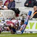 Young winger Lewis Murphy squeezes over in the corner for a well taken try as Wakefield Trinity challenged Wigan Warriors in the first half of their Betfred Challenge Cup tie. Picture: Tony Johnson