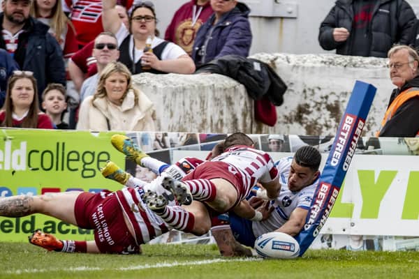 Young winger Lewis Murphy squeezes over in the corner for a well taken try as Wakefield Trinity challenged Wigan Warriors in the first half of their Betfred Challenge Cup tie. Picture: Tony Johnson