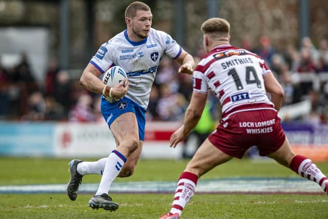 Wakefield's James Batchelor runs at Wigan's Morgan Smithies. He was picked out as a stand-out by Trinity coach Willie Poching. Picture Tony Johnson