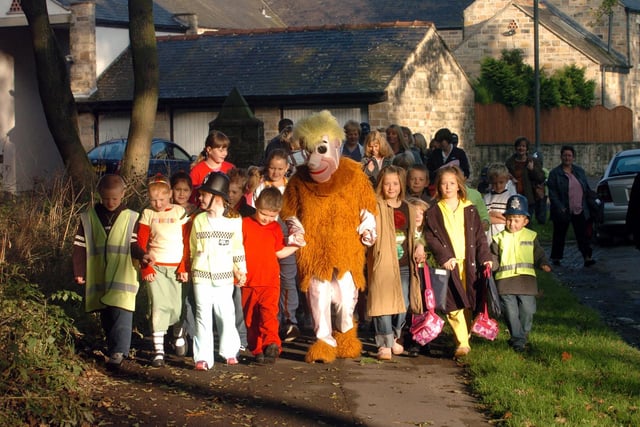 Pupils from Stanley Grove Primary School, near Wakefield, practicing how to walk to school safely with a little help from Barney Rubble.