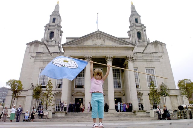 Charlotte Searle of Wakefield, holds aloft a Yorkshire Rose flag in front of Leeds Civic Hall as part of the Yorkshire Day Celebrations.