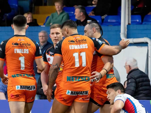 Castleford Tigers players celebrate a try in their 34-4 win at Wakefield Trinity. Picture: Allan McKenzie/SWpix.com