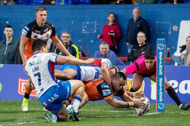 Castleford Tigers' Mahe Fonua dives over to score a try against Wakefield Trinity. Picture: Allan McKenzie/SWpix.com