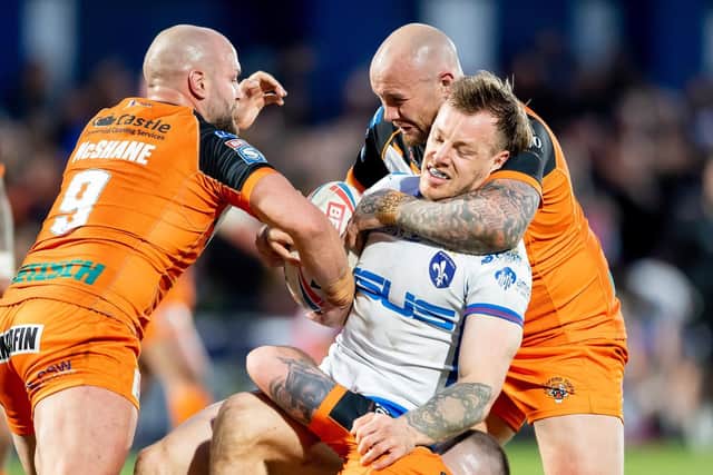Wakefield Trinity's Tom Johnstone is tackled by Castleford Tigers duo Paul McShane and Nathan Massey. Picture: Allan McKenzie/SWpix.com