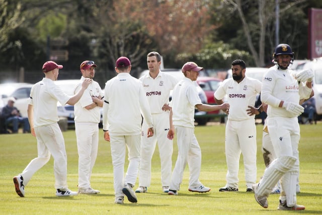 Woodlands captain Brad Schmulian, centre, celebrates with his teammates after bowling out Abdul Wahid.