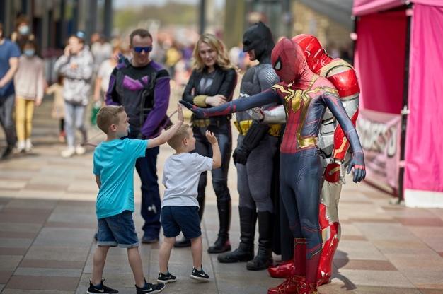 A high-five from Spider-Man and Iron Man.