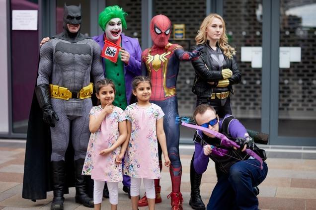 Stopping for a photo with their young fans.