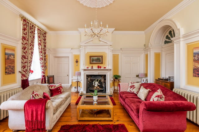 Huge windows, arched doorways and focal fireplaces all impress within The Dower House.