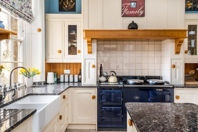A gas Aga has pride of place in the bright and spacious kitchen.