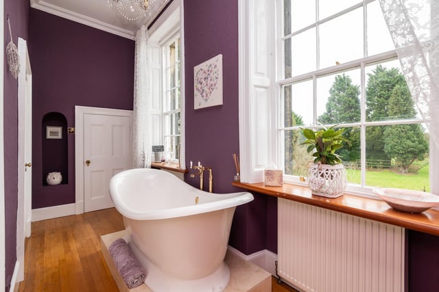 A quirky bathroom with a deep, free standing bath tub in which to soak away the stresses of the day.