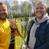 Kirklands captain Chris Wilde was presented with the Premiership Two League Cup by W&DSFL's guest of honour Brett Mercer.