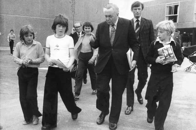 Young autograph hunters catch Sir Harold Wilson as he leaves Featherstone High School, 1976.