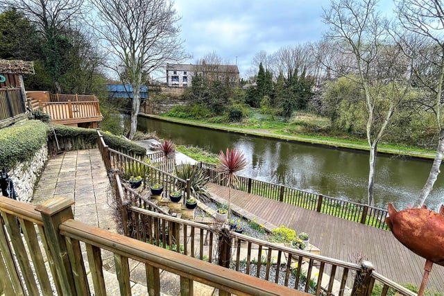 The scenic approach to the canal from the property's extensive gardens.