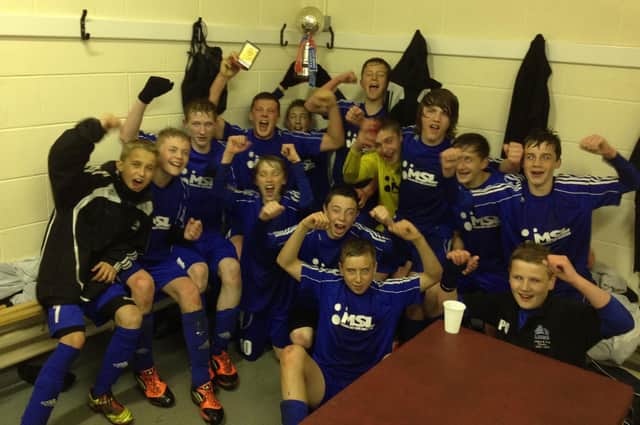St Joseph's U14s celebrate in the dressing room after winning the West Riding County Cup for the second year in succession. In the final they defeated Halifax Irish U14s 4-1.