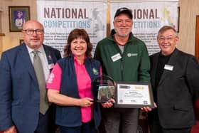 Revolutions Brewing's Mark Seaman presented with the Overall Champion Award by Grahame Morris MP, Beth Eaton of award sponsor Charles Faram, and Ian Mearns MP.