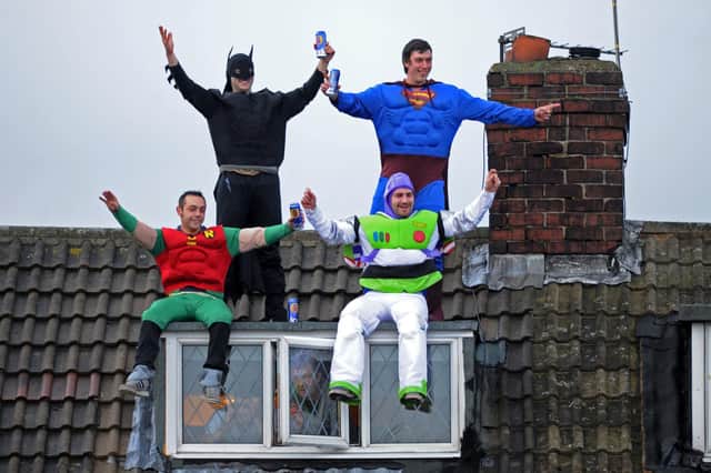 Featherstone Rovers fans were so keen to see their team take on Wigan Warriors in the Challenge Cup 10 years ago that they were eager to get any vantage point, including these supporters dressed as super heroes who watched from the roof of a house overlooking the pitch.
