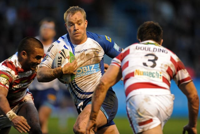 Jonny Hepworth comes up against Wigan's Thomas Leuluai and Darrel Goulding in a game that would finish 32-16 to the Warriors.