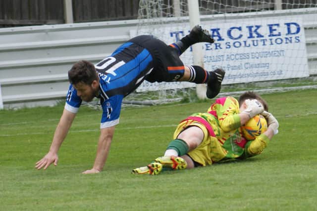 The Crown Scissett goalkeeper makes a brave save against West End Terriers. Picture: Angie Breen