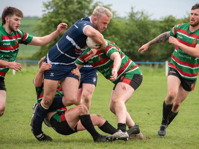 Chris Bingham escapes the clutches of several West Bowling defenders. Picture: Jonathan Buck