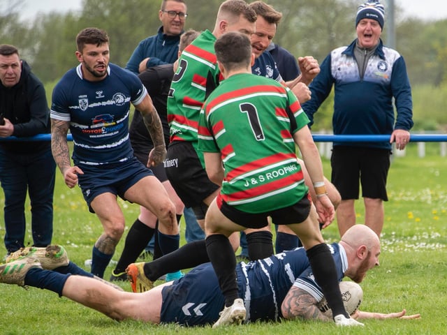 Featherstone Lions forward Sam Millard crashes over for the game winning try that put his team 10 points clear. Picture: Jonathan Buck