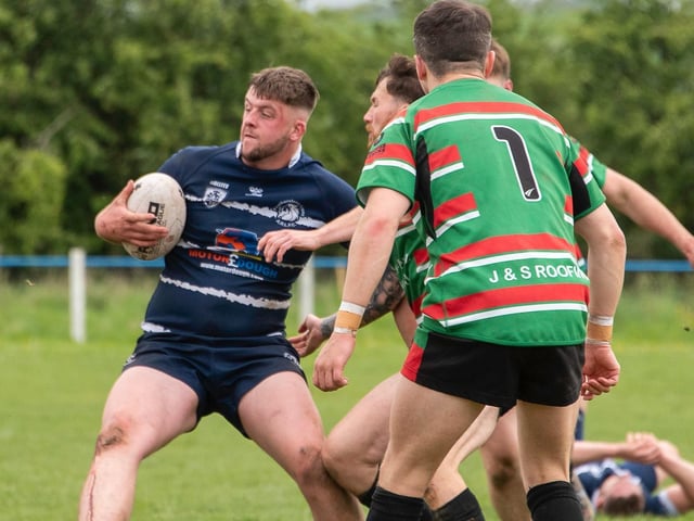 Featherstone Lions packman Jake Roberts holds the West Bowling defenders at bay. Picture: Jonathan Buck