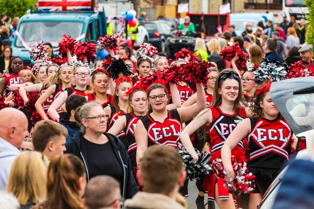 Elite Cheerleaders, resplendent in black and red.