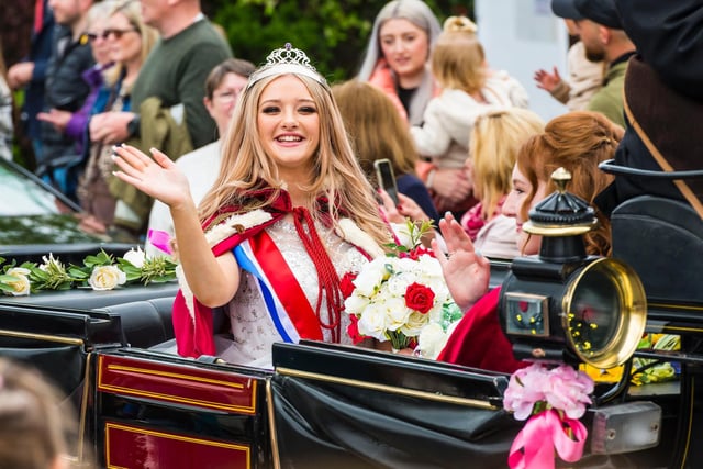 May Queen Mia Turton waves to the crowds.