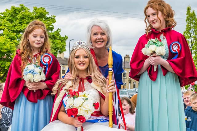 May Queen  Mia Turton  with her maids of honour, Amy Stockhill and Emma Marsden and  Mavis Oldroyd, who was the 1961 Gawthorpe May Queen.