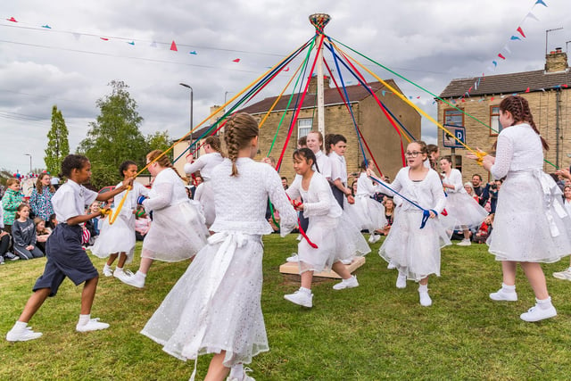 Maypole dancers from Gawthorpe Academy take part in a 148-year-old tradition of mayole dancing on Gawthorpe village green