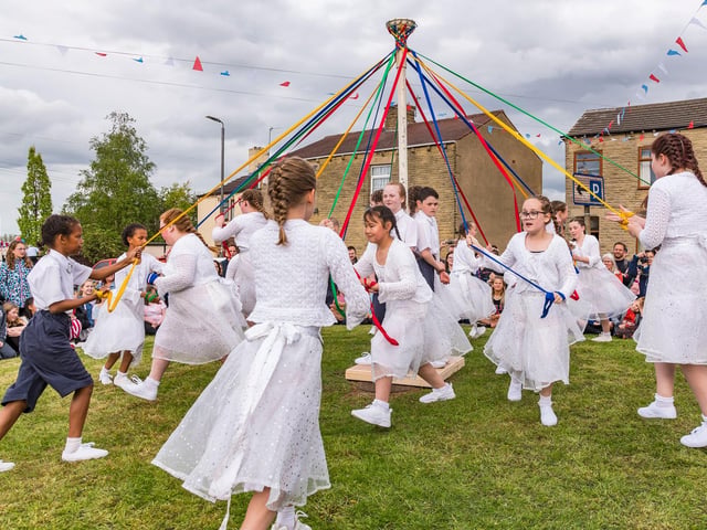 Maypole dancers from Gawthorpe Academy take part in a 148-year-old tradition of mayole dancing on Gawthorpe village green