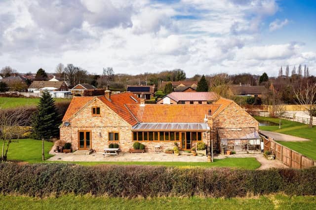 This sizeable home, built on the site of a former farmhouse, is for sale priced £800,000.
