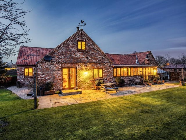 A welcoming glow from lights inside the property as night falls.....