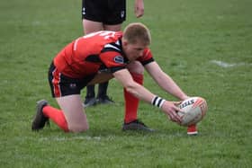 Charlie Barker landed six goals and crossed for a try in Normanton Knights' victory over Dewsbury Moor Maroons.