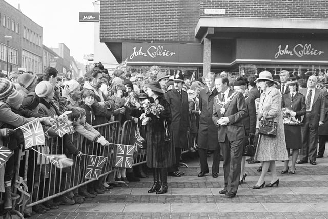 The Queen receives posies from well-wishers in Wakefield.