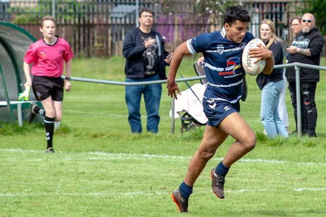 Prashant Veerasamy races clear on his way to an exciting try for Featherstone Lions at Myton Warriors. Picture: Jonathan Buck