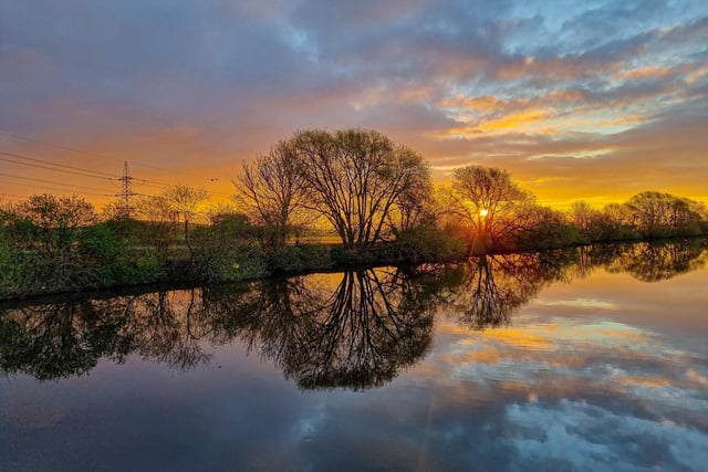 Sunrise and reflections from the banks of the River Aire at Ferrybridge, by Lee Crowther.