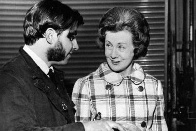 Barbara Castle stops to have a few words with Mr. Michael Austin who is working in the motor repair department after she opened a new Government Training Centre at Doncaster Road, Wakefield in 1970.