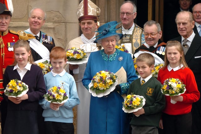 The Bishop of Wakefield the Rt Rev Stephen Platten behind Queen Elizabeth after the Maundy Service at Wakefield Cathedral, 2005.