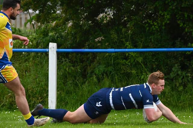 Jack Townend dives over to open the scoring for Featherstone Lions. Picture: Jonathan Buck
