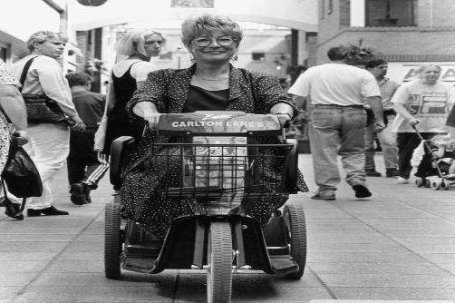 Sue Harris using the Carlton Lanes shop-mobility electric wheelchair