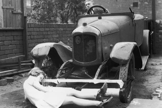 J T Griffin of Castleford demonstrates his road safety lifeguard which he claims will greatly reduce fatalities on the road. Rollers fitted beneath the radiators of vehicles prevent objects from going underneath the car.