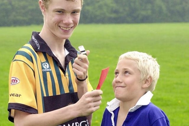 Jason and Oliver Tobin, who played and refereed rugby league. Jason is pictured red carding his brother Oliver.