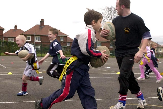 Youngsters enjoy a game of tag rugby at the Outwood Grange College Pay to Play day.