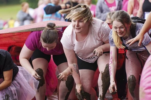 In Pretty Muddy, runners have to make their way through a muddy obstacle course.