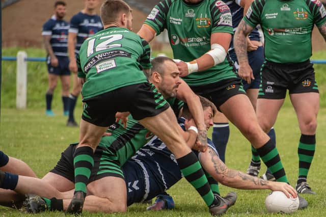 Jake Roberts reaches out to get the ball down over the line for Featherstone Lions' opening score against Wigan St Patricks. Picture: Jonathan Buck