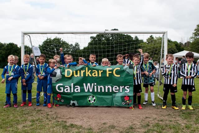 Durkar Devils gala winners Hall Green (black and white striped kit) and Redfearns (blue).